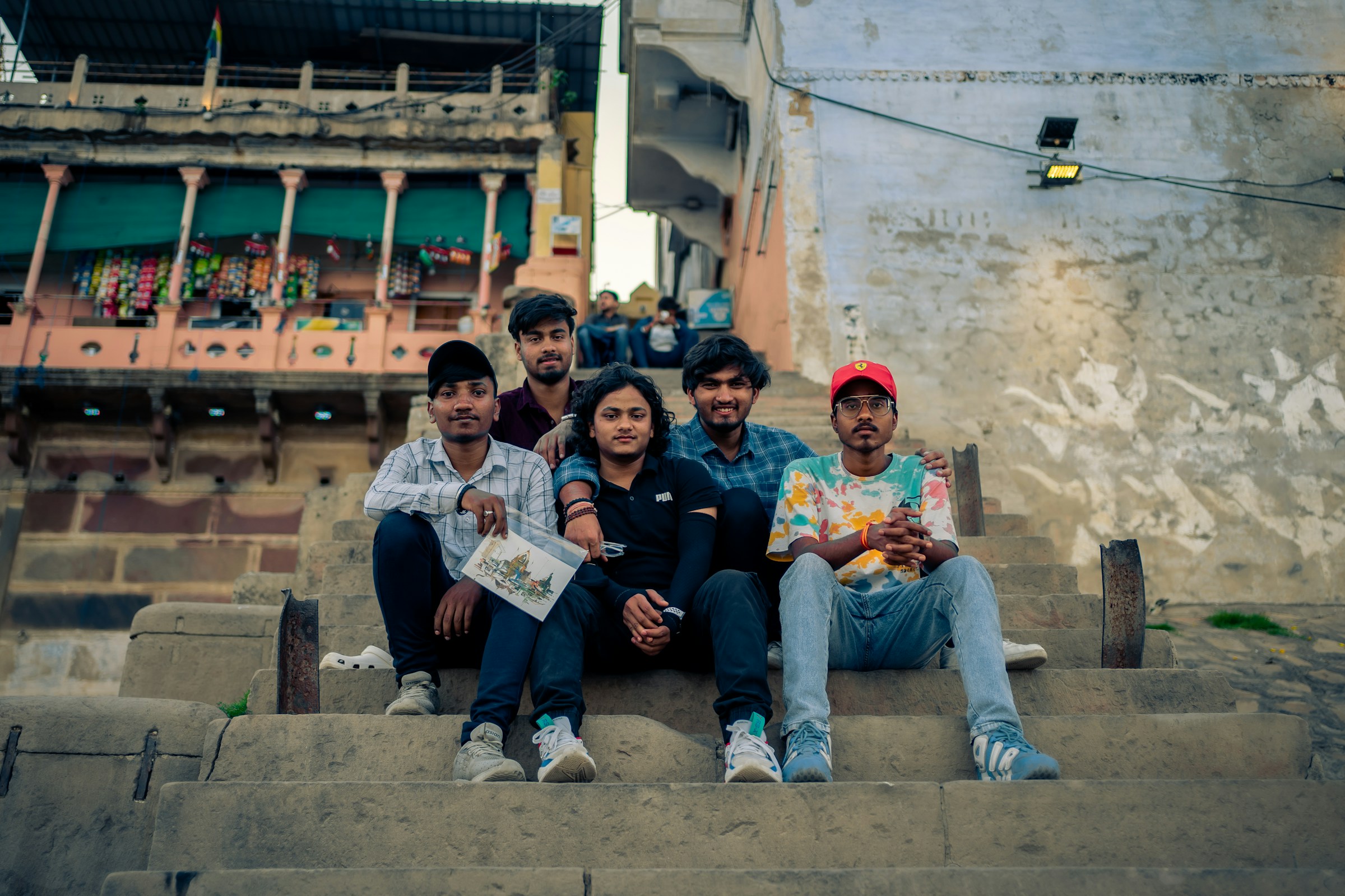 Indian students sitting together on campus steps